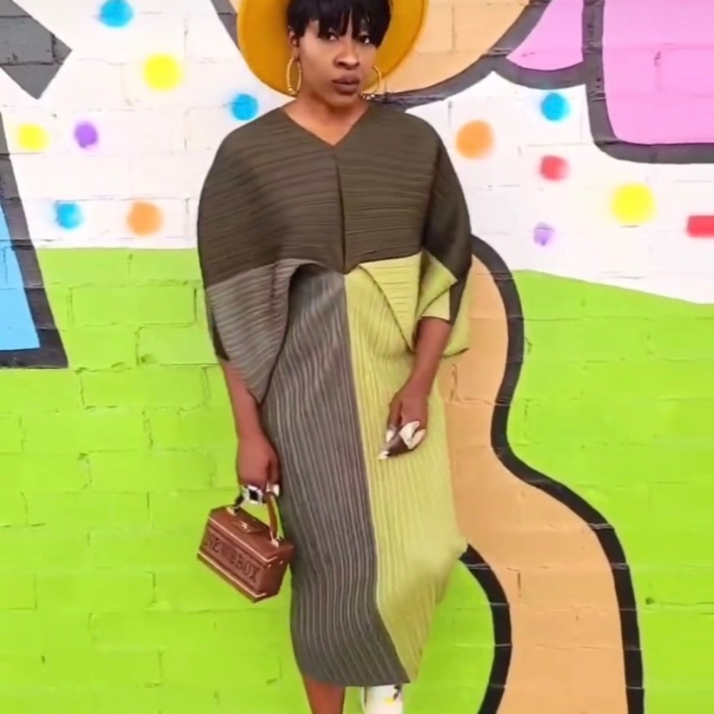 A wearable work of art, this dress pops with abstract shades of color